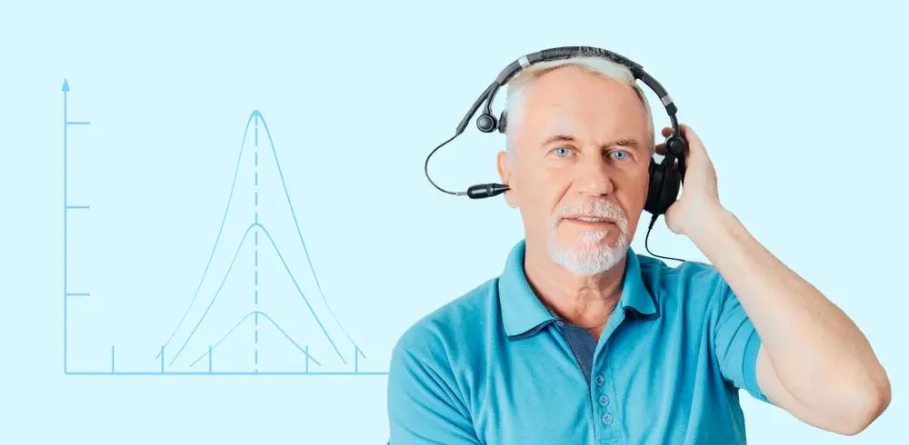 older man taking a audiologist hearing test